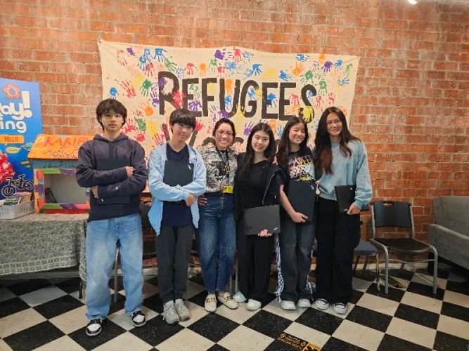DNHS Students Distribute Laptops to Afghan Refugees at IRC El Cajon